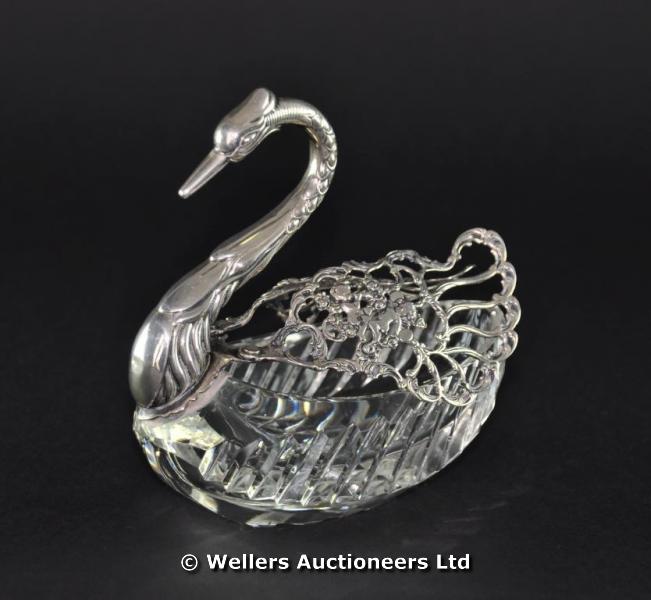 A Continental white metal and cut glass trinket box in the form of a swan