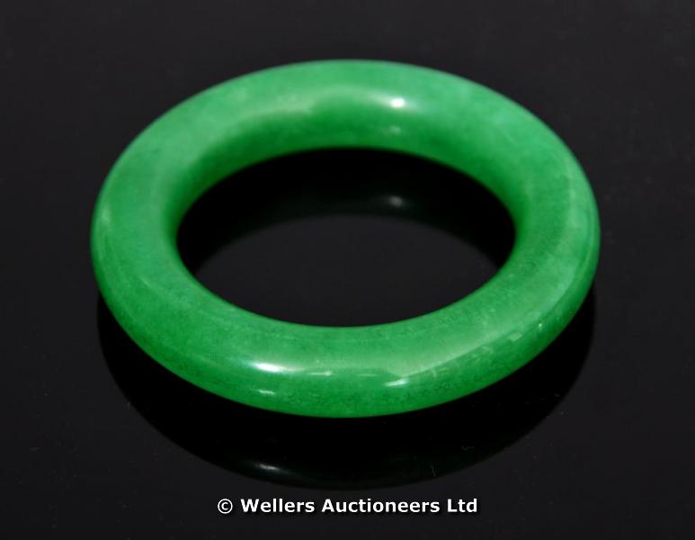 "A circular jade bangle, 8cm diam. "