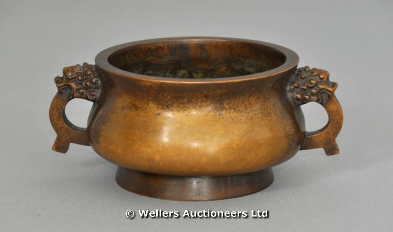 "Chinese two-handled bronze censer with lion mask handles, Chien Lung mark"