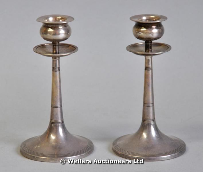 "A pair of Walker & Hall silver candlesticks, Sheffield"