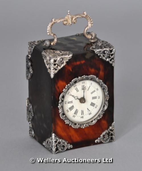 "A tortoiseshell and silver carriage clock, London 1896, with ornate handle, 11.5cm high "