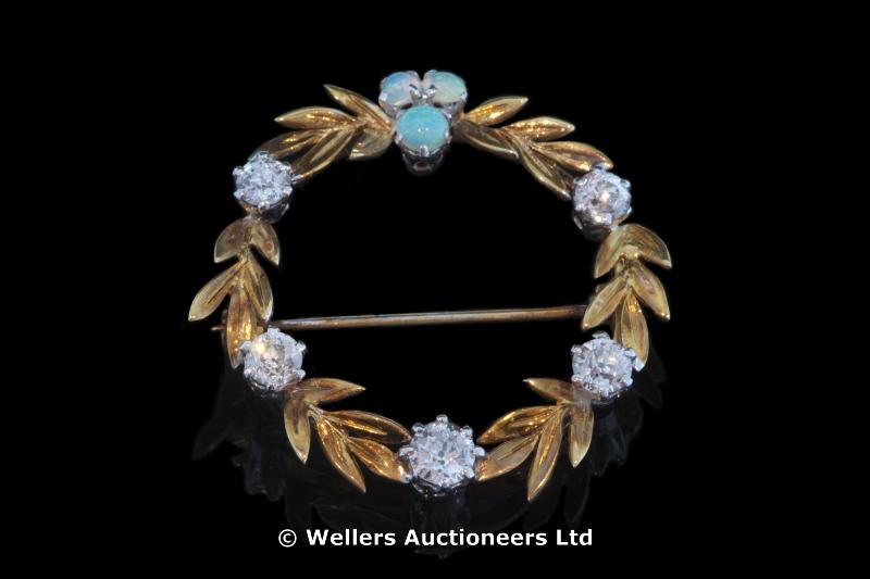 "Opal and diamond brooch set in a wreath design, three cabochon cut opals weighing an estimated