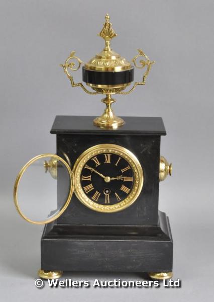 "Black slate mantle clock, gilt metal details and surmounted by a vase finial, movement marked