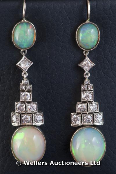 "Pair of opal and diamond earrings, consisting of an oval cabochon cut opal suspended from six round