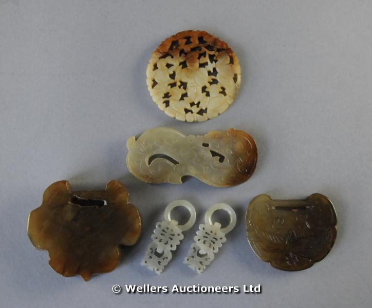"Hardstone small carved fasteners, ring form; two brown half buckles; pierced circular variegated