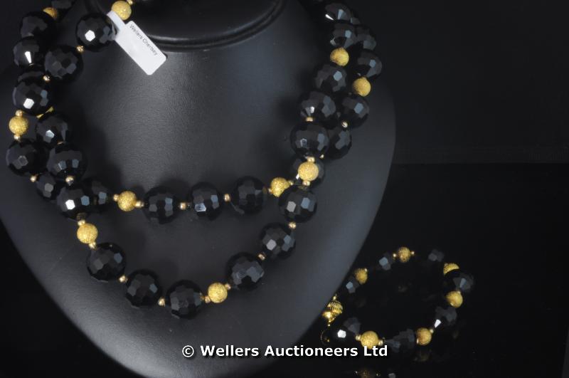 Black onyx and gold plated rondelles necklace and bracelet