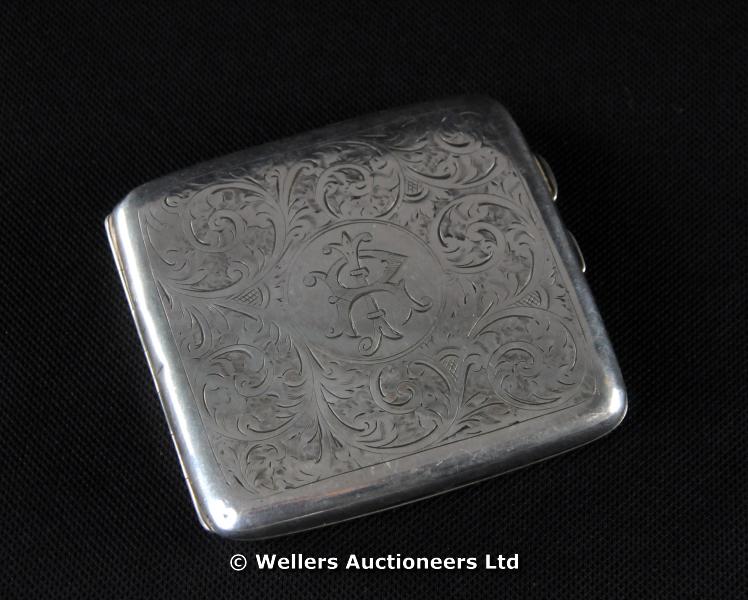 "A silver cigarette case, foliate scrolls, Birmingham 1919, makers mark R & M, 100grs approx. "