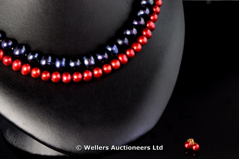 "*Dyed red freshwater pearl necklace with matching ear studs, together with a dyed blue freshwater