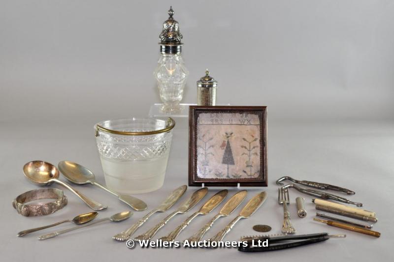 A silver plated sugar caster; three propelling pencils; a quantity of plated flatware; and a sampler