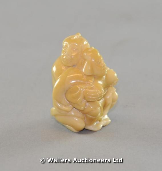"A 20thC Chinese netsuke, couple in an erotic pose, 5cm high"