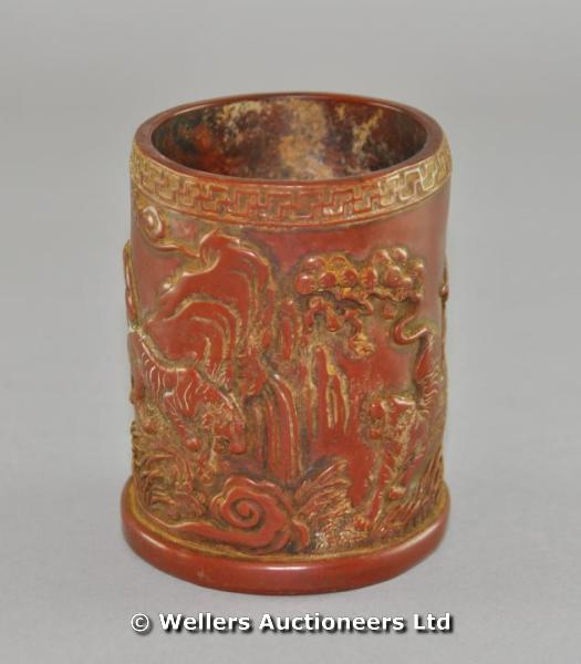 "A 20thC Chinese terracotta brush pot decorated with tigers, script to side, 11cm high"