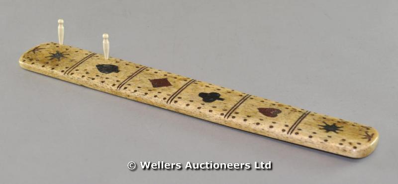 "A Georgian ivory cribbage board, 36 x 5cm approx."