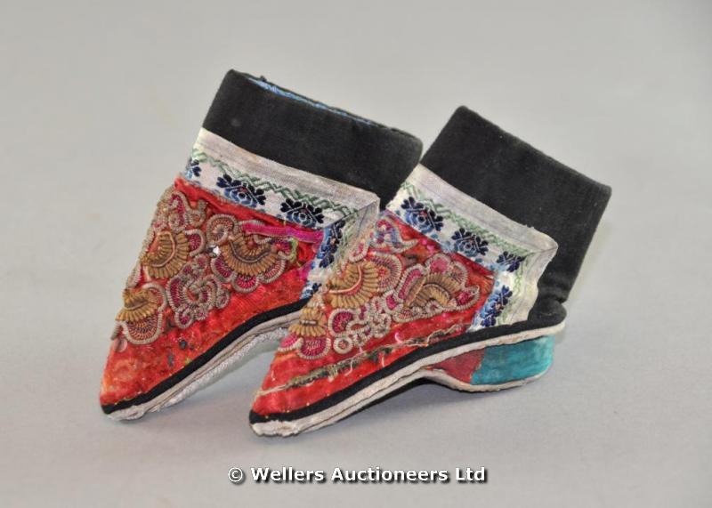 "A pair of Chinese children`s shoes, embroidered with gold thread and silk flowers"