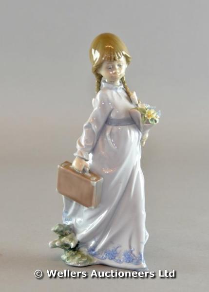 "A Lladro Collector`s Society first issue porcelain figure of a girl holding a bouquet of flowers