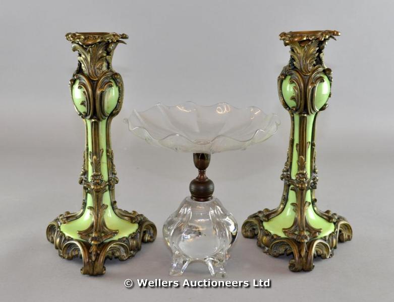 "A pair of French brass mounted green porcelain candlesticks, each with floral & rococo