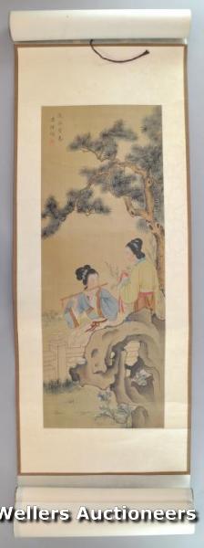 "A 20thC Chinese scroll of two ladies beneath a tree, one playing a flute, signature to top left