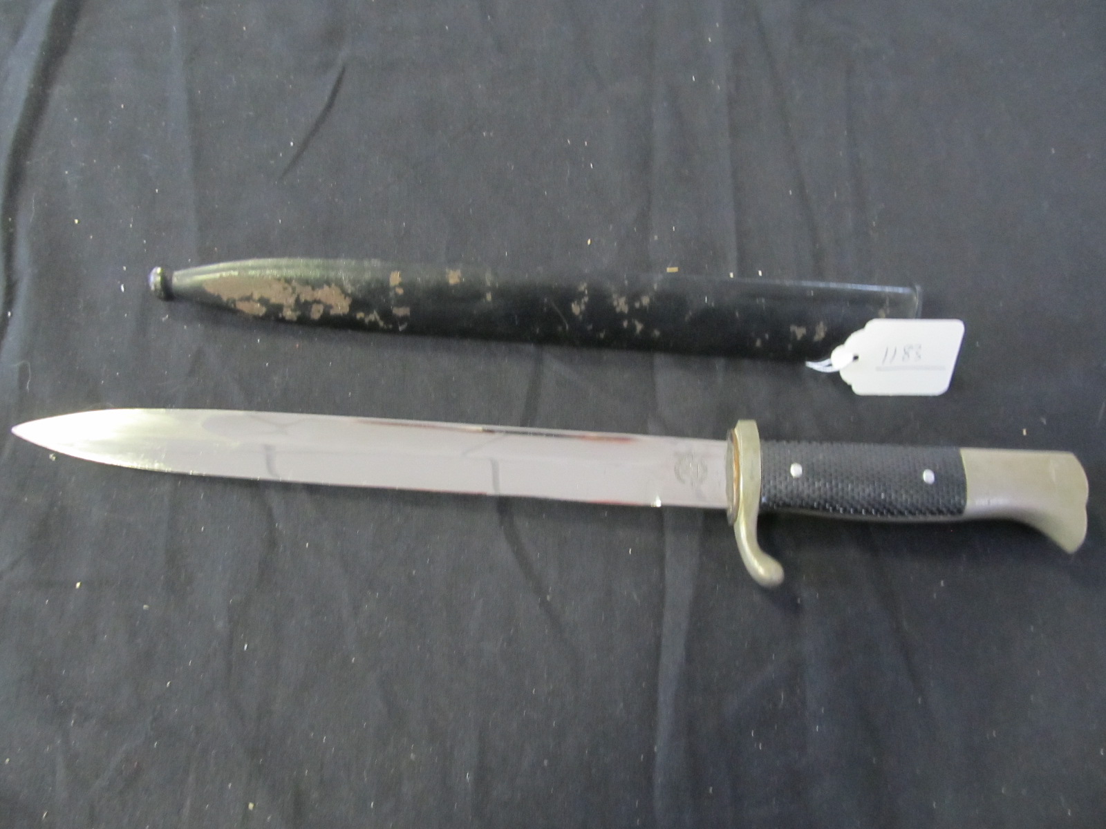 German WW2 Fire service bayonet in its metal scabbard, blade maker marked `Robert Klaas Solingen`.