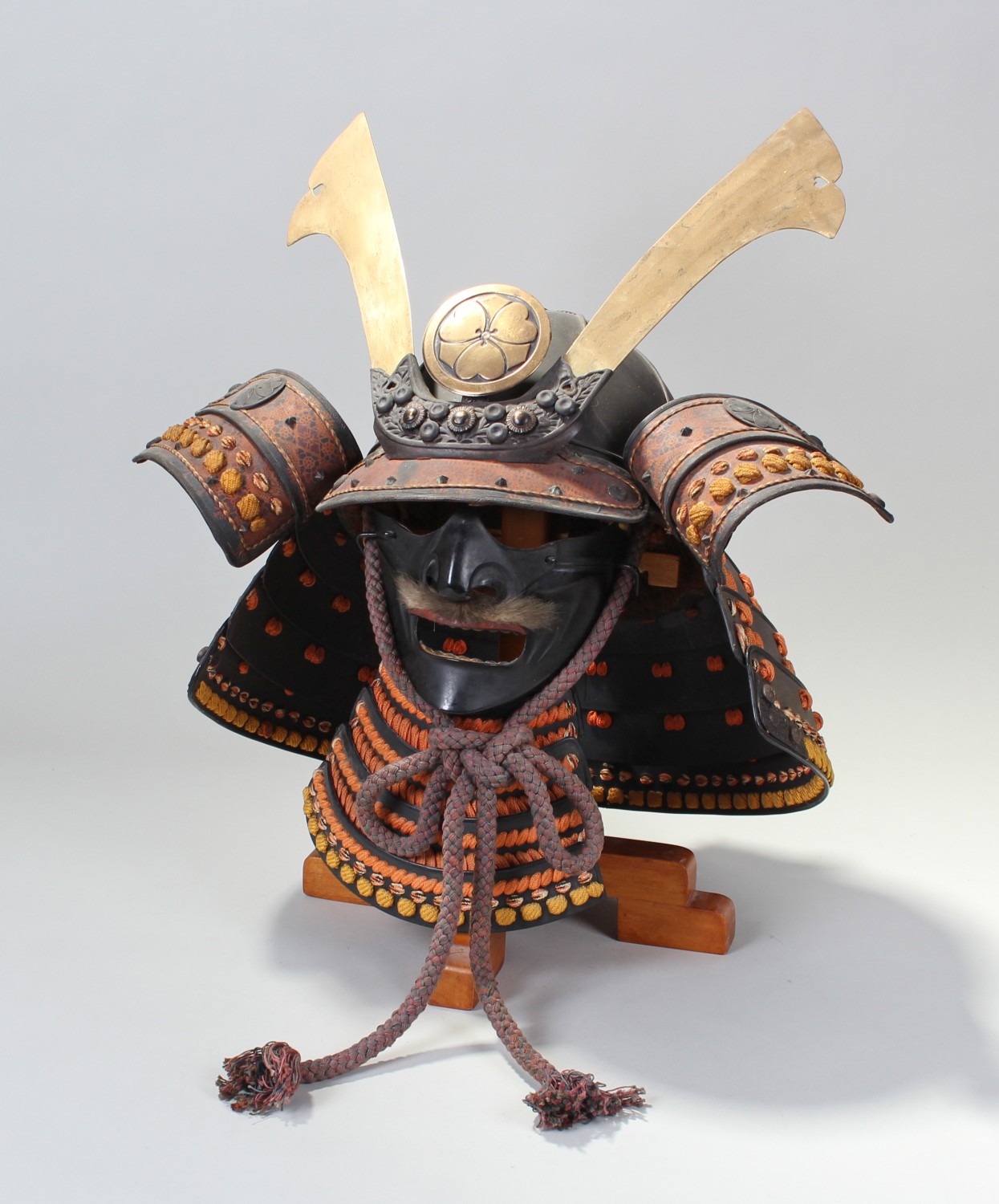 19th Century Japanese Samurai kabuto and mempo, Maji Clan, brass and metal with orange braid work,