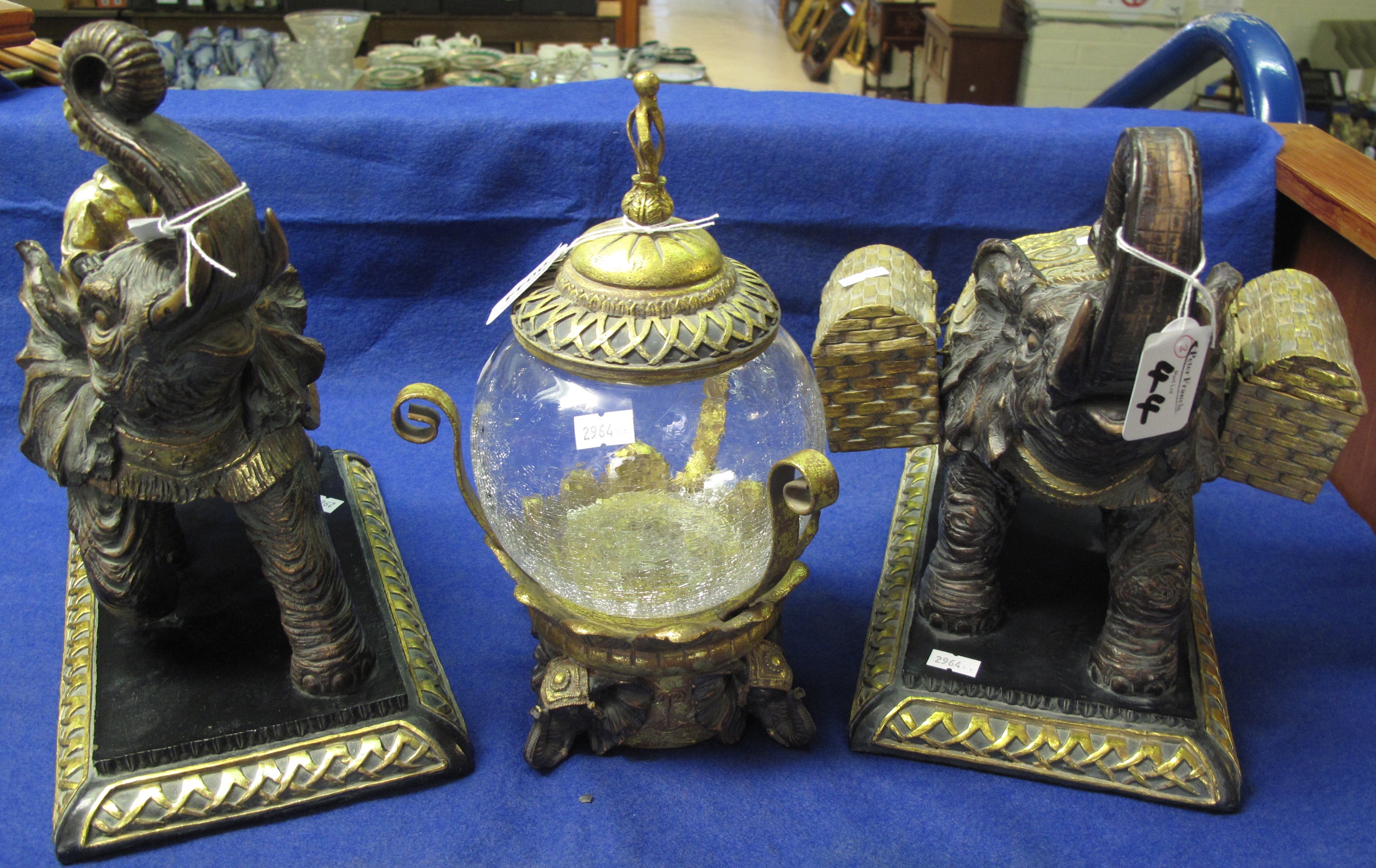 Pair of gilded & lacquered carved wooden Elephants one with Rider the other with Wicker Baskets,