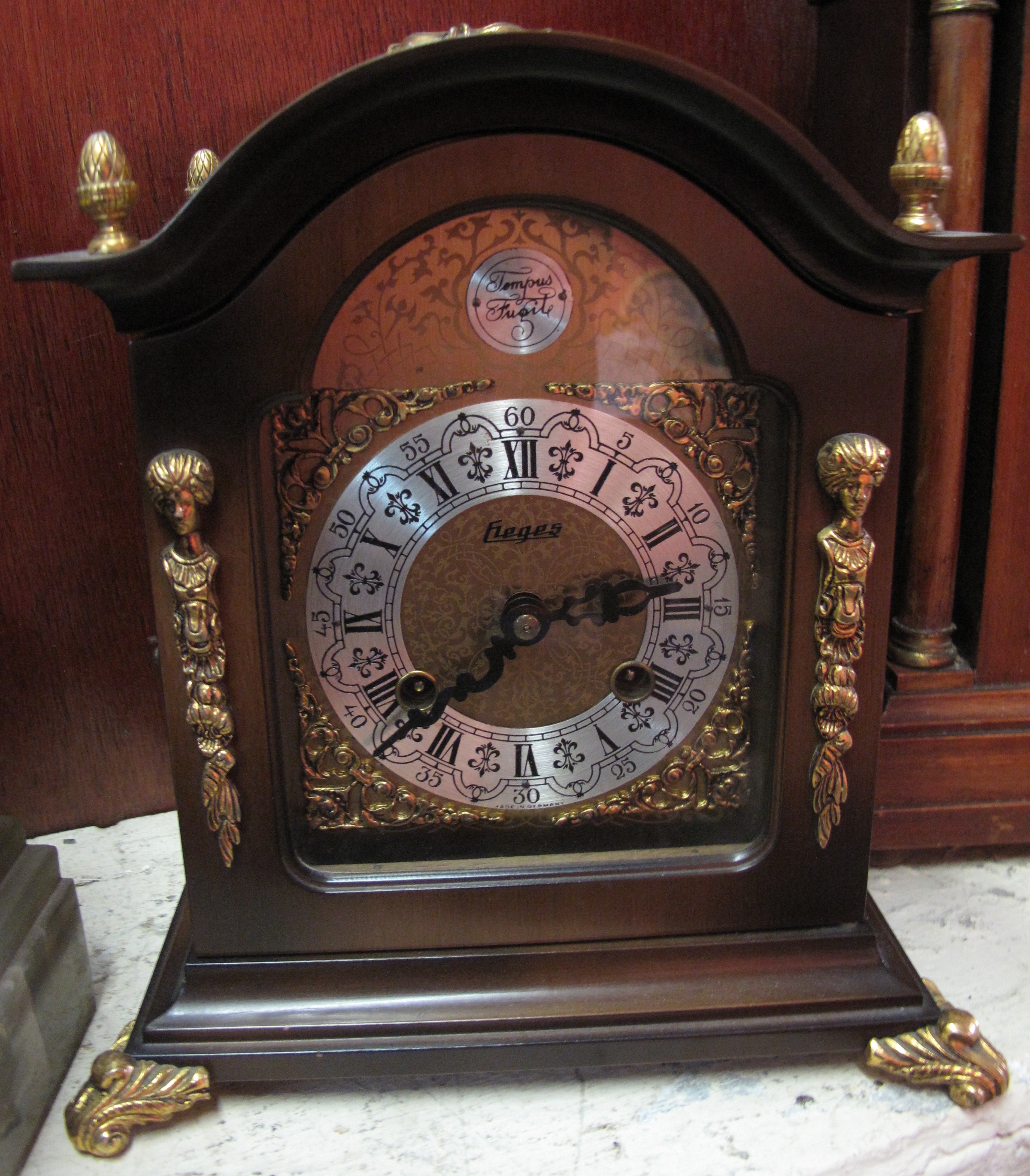 Modern 18c style two train metal mounted mantle clock