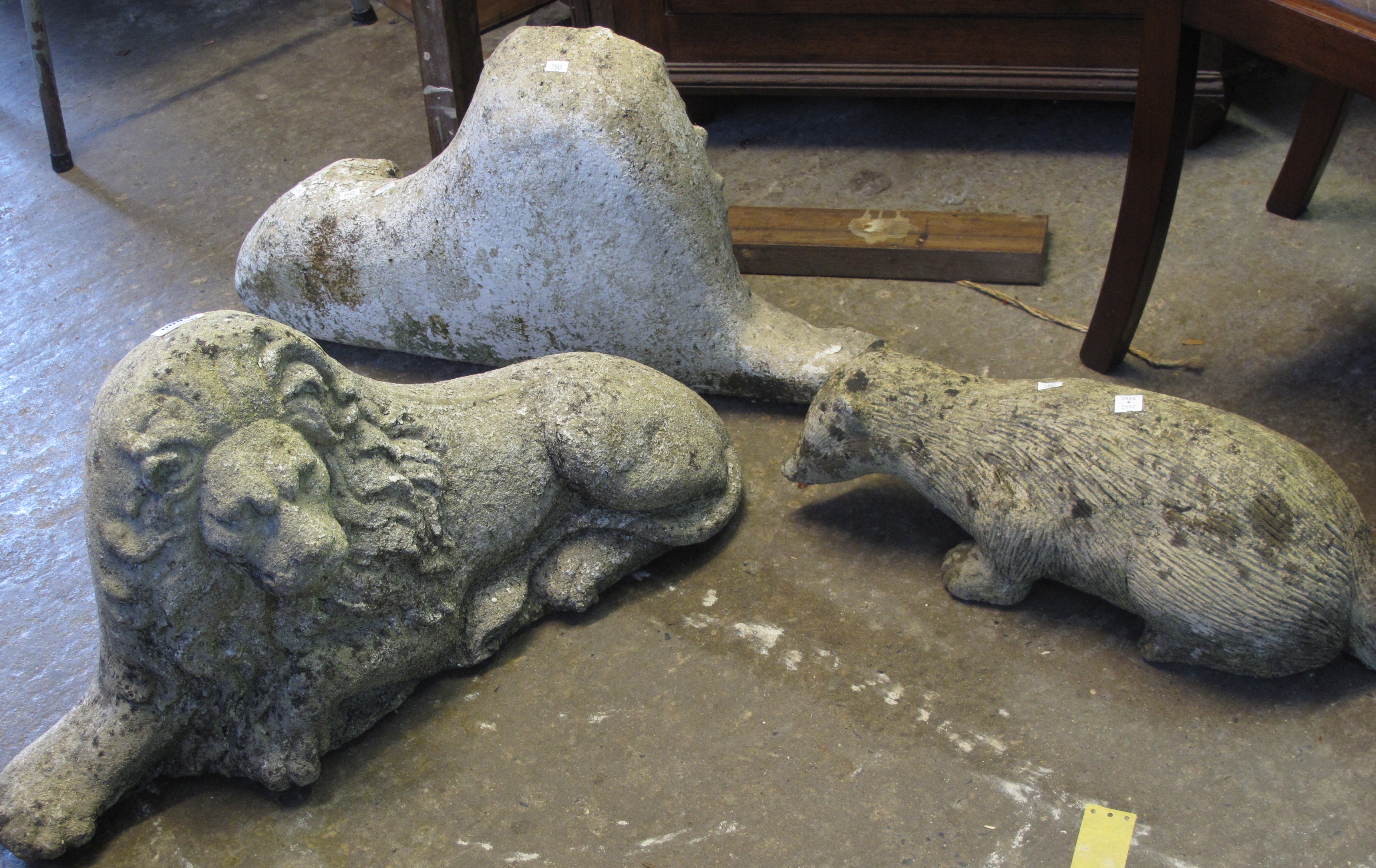 Pair of reconstituted stone stone/concrete Lions  & a similar Badger (3).