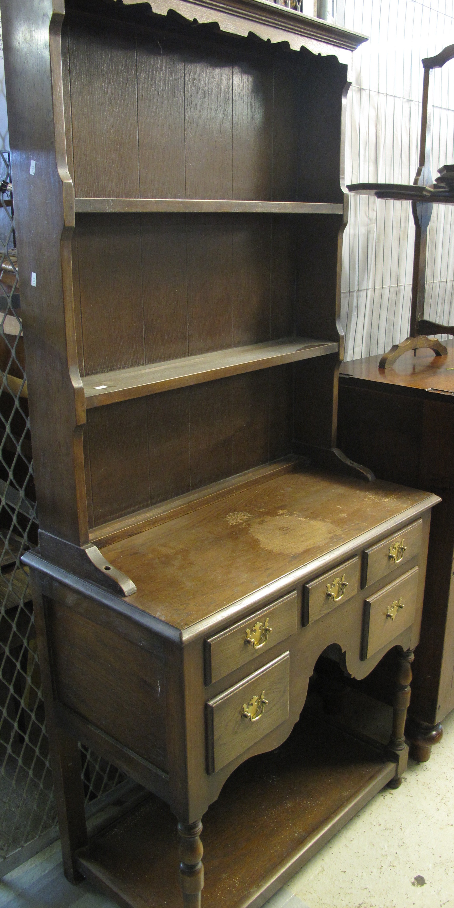 Small reproduction oak pot board dresser with boarded two shelf rack back.