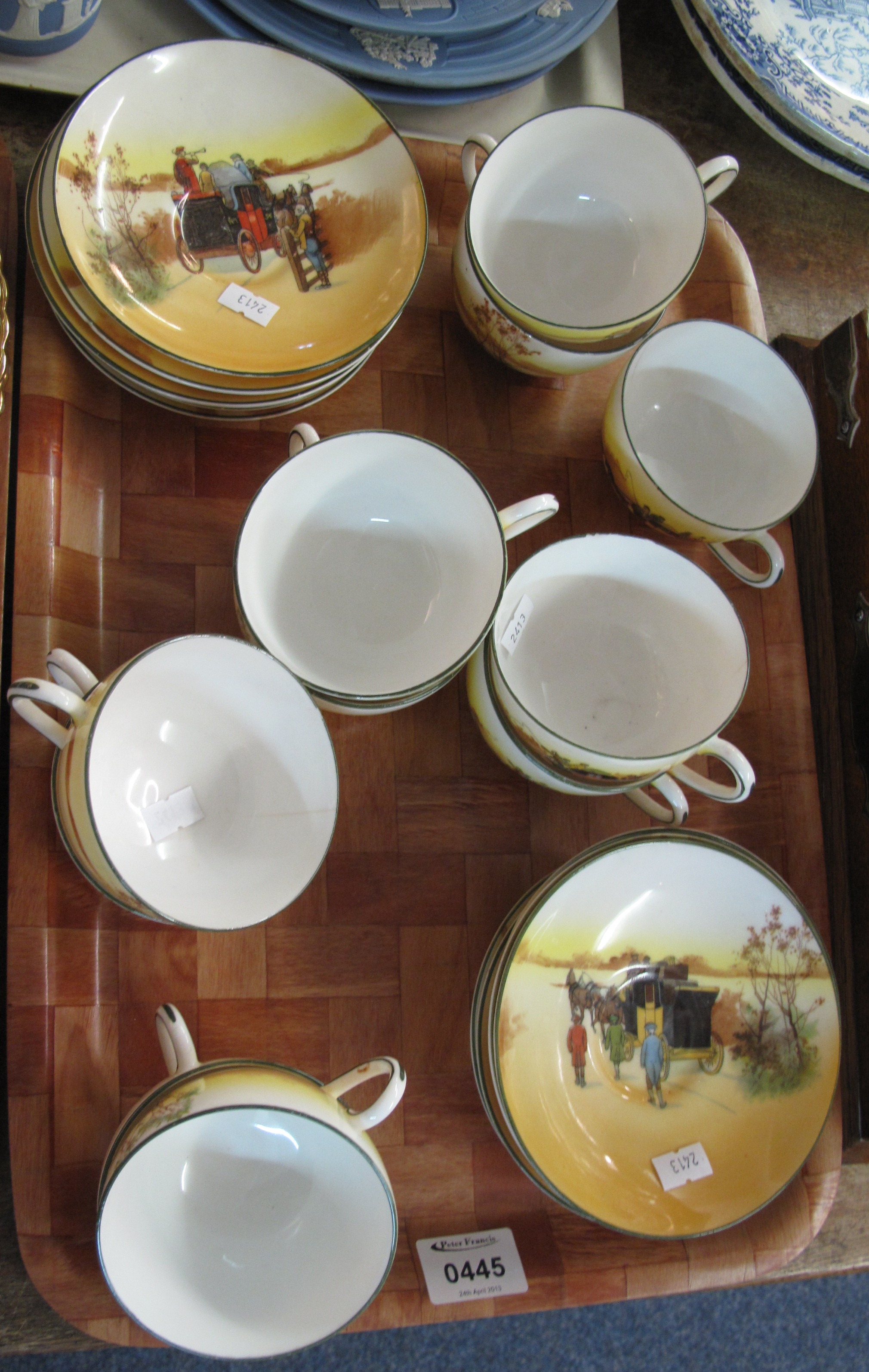 Small tray of Royal Doulton cups & saucers overall decorated with Horse & Cart scenes registration