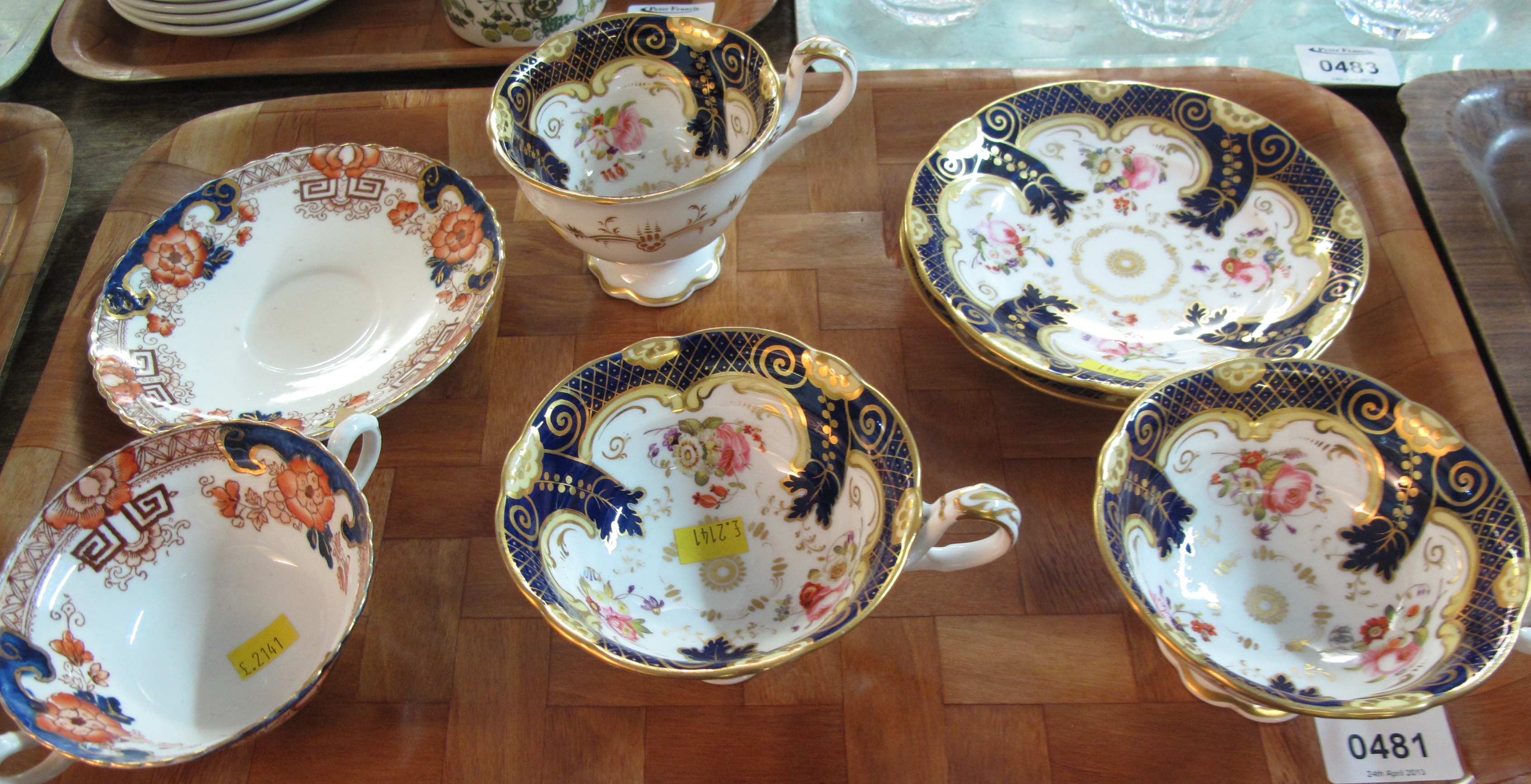 19c English Porcelain cabinet cups & saucers overall decorated on a white ground with blue & gilt