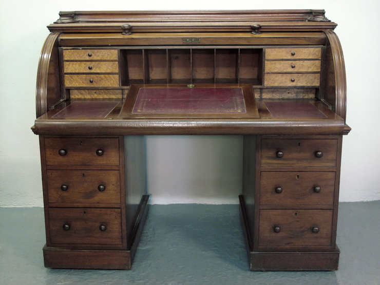 VICTORIAN MAHOGANY CYLINDER FRONTED WRITING DESK, the solid cylinder with turned knobs revealing