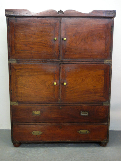 19TH CENTURY TEAK CAMPAIGN CUPBOARD CHEST, having shaped cornice over two pairs of blind cupboard