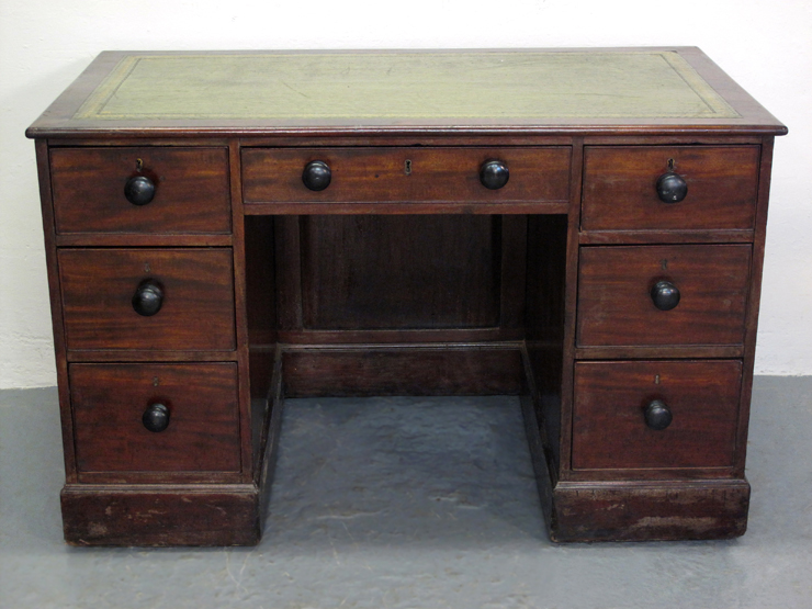 VICTORIAN MAHOGANY KNEE HOLE DESK, having inset tooled leather writing surface with moulded edge
