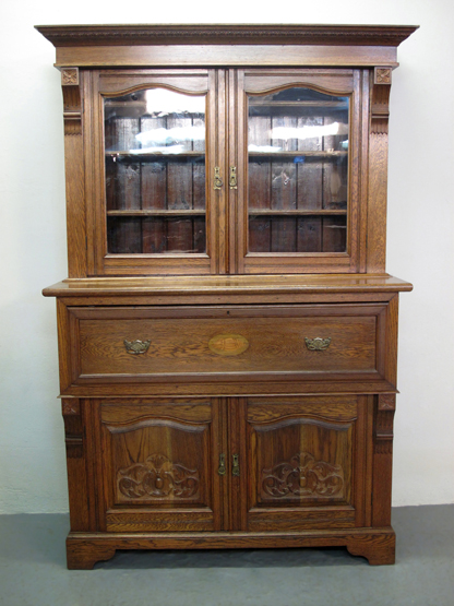 EARLY 20TH CENTURY WELSH OAK SECRETAIRE BOOKCASE, having moulded cornice over two arch glazed