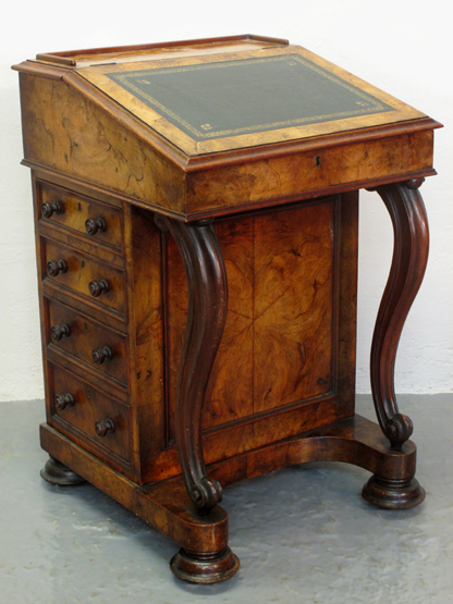 VICTORIAN WALNUT DAVENPORT DESK, having low solid gallery to the back, slope front with inset tooled