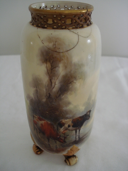 Royal Worcester vase,, cream base decorated with hand painted Highland cattle in an upland
