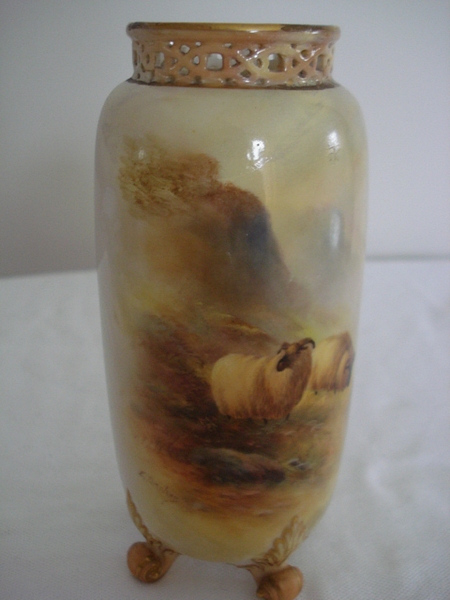 A Royal Worcester vase, decorated ivory with hand painted sheep in a glen, signed Ernest Barker