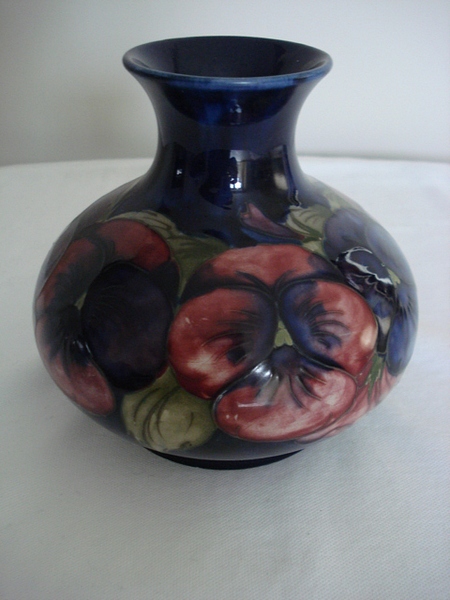 A William Moorcroft flambé glaze Pansy pattern vase, Circa 1913-1918, form of compressed baluster