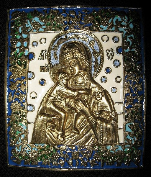 Russian, a 19th.Century brass Icon of The Virgin of Vladimir, decorated with four colours of
