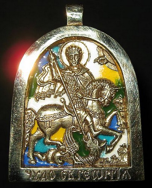 Russian, a 19th.Century travelling brass Icon of depicting St George slaying the Dragon, decorated