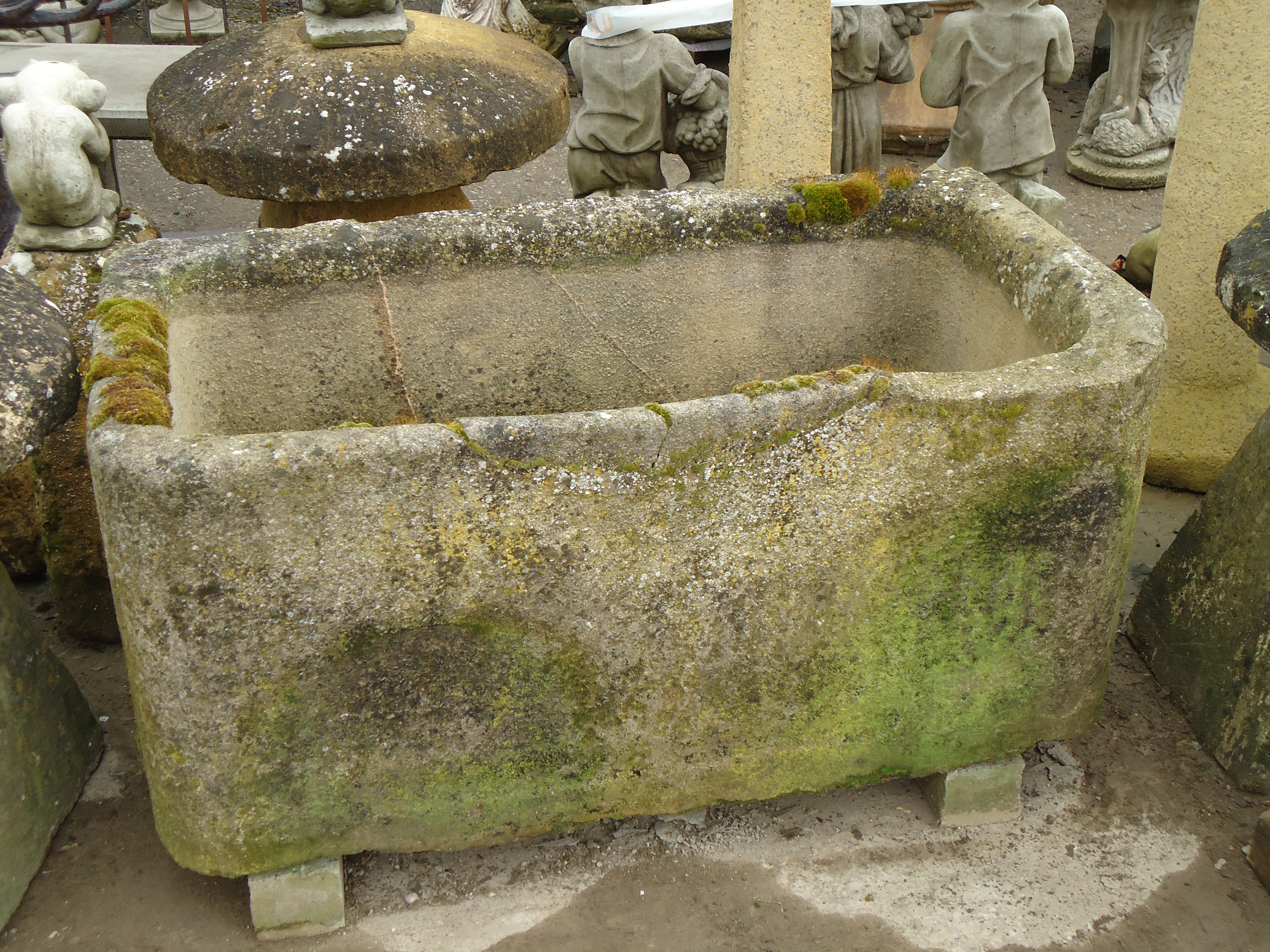 An antique, weathered, large natural stone trough 1092mm (43"") length 558mm (22"") height  610mm (