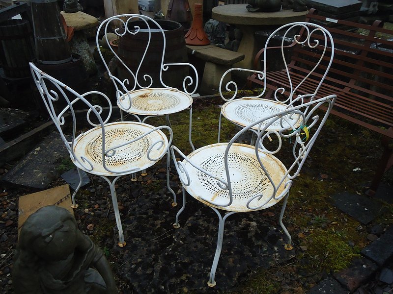 A set of 4 old French, ornate metal garden chairs with arms  915mm (36"") high at the back x