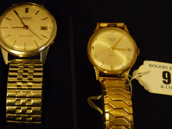 Watches.  Two wristwatches.  A gent`s 9 carat gold-encased circular dial Avia calendar wristwatch