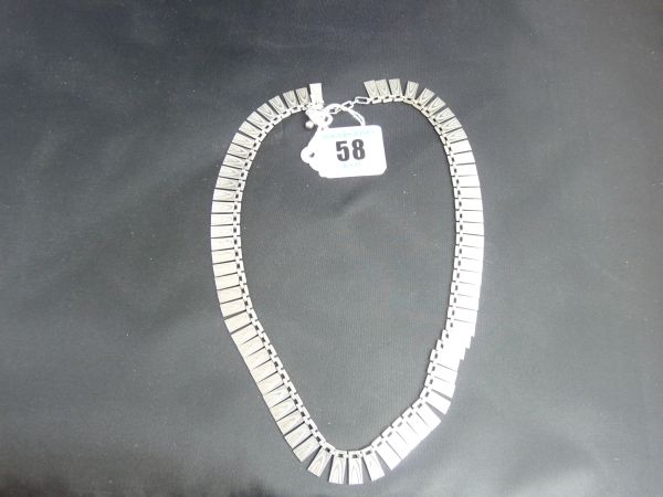 Jewellery.  A silver necklace of bright-cut Art Nouveau- style decoration; 32.5 grms.