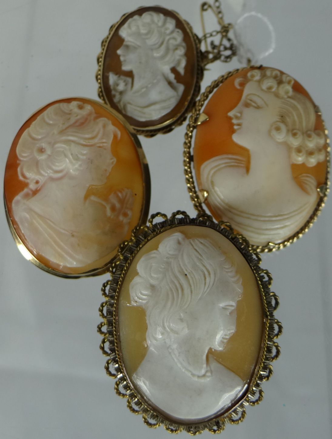A parcel of four cameo portrait brooches