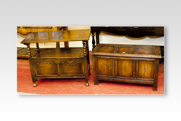 A neat antique reproduction oak blanket box, the top and the front having inset panels, 35 ins (89