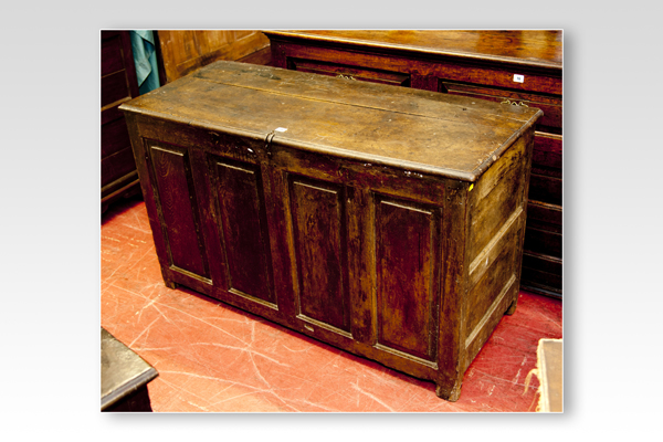 An 18th Century oak dower chest having four long fielded panels, 49 ins (125 cms) wide