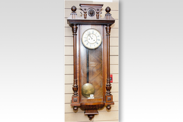 A walnut and mahogany encased double weight Vienna wall clock (weights absent), (catalogue