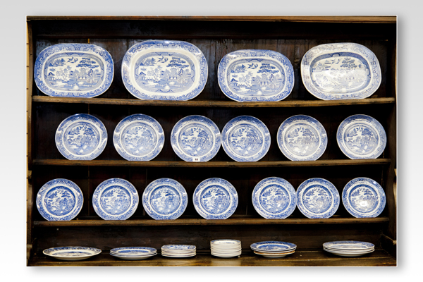 The Willow patterned pottery plates and platters as displayed on Lot 39