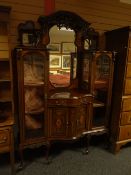 An impressive inlaid mahogany Edwardian serpentine cabinet-sideboard on six cabriole supports,
