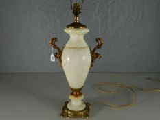 A grey marble baluster-shaped electric table-lamp mounted with a pair of bright ormolu griffin