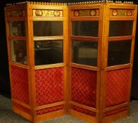 A late nineteenth century Gothic-revival four section oak and beveled glass folding screen, in the